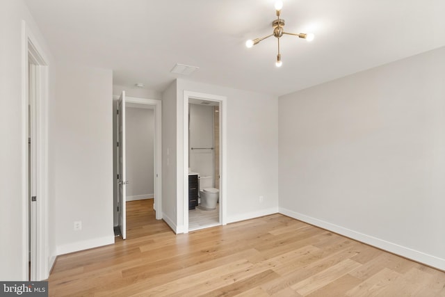 1554 Davidson Rd, Mclean, VA 22101 - unfurnished bedroom featuring light wood-style flooring, baseboards, and ensuite bath