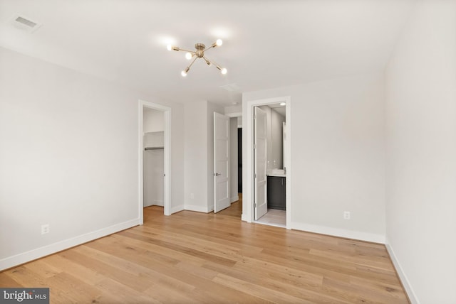 1554 Davidson Rd, Mclean, VA 22101 - unfurnished bedroom with a chandelier, a spacious closet, and baseboards