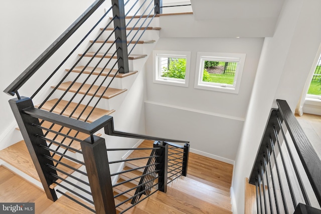 1554 Davidson Rd, Mclean, VA 22101 - stairway featuring plenty of natural light, wood finished floors, and baseboards