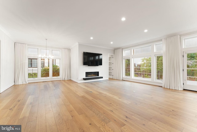 1554 Davidson Rd, Mclean, VA 22101 - unfurnished living room with crown molding, a chandelier, a glass covered fireplace, light wood-style flooring, and recessed lighting