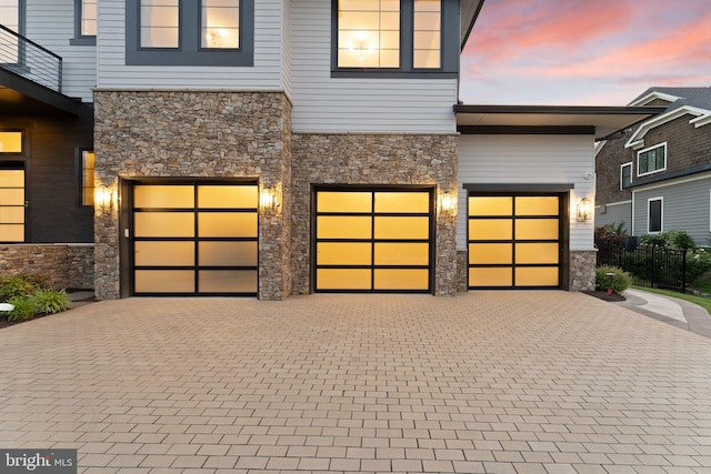 1554 Davidson Rd, Mclean, VA 22101 - view of front facade featuring stone siding, an attached garage, and decorative driveway