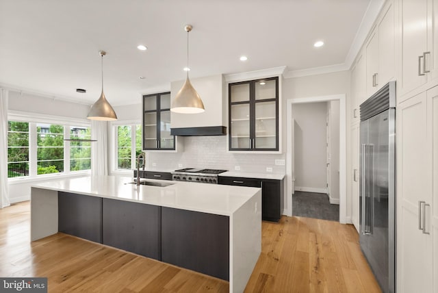 1554 Davidson Rd, Mclean, VA 22101 - kitchen with built in refrigerator, a sink, range, light countertops, and custom exhaust hood