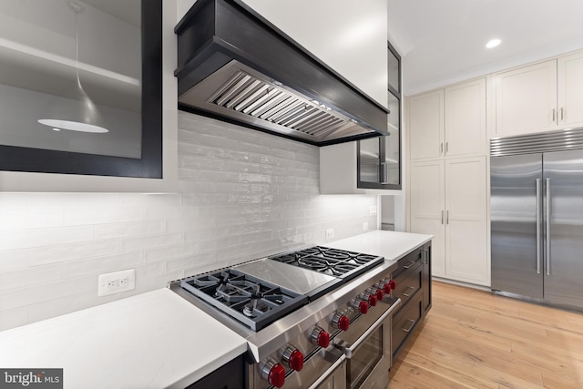 1554 Davidson Rd, Mclean, VA 22101 - kitchen featuring high end appliances, custom exhaust hood, light countertops, recessed lighting, and tasteful backsplash