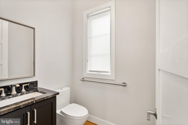 1554 Davidson Rd, Mclean, VA 22101 - bathroom featuring toilet, vanity, and baseboards