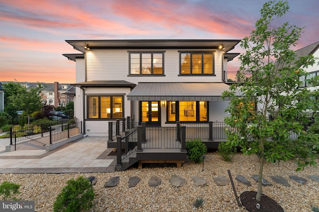 1554 Davidson Rd, Mclean, VA 22101 - back of house at dusk with french doors and a patio