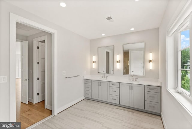 1554 Davidson Rd, Mclean, VA 22101 - full bath featuring double vanity, plenty of natural light, baseboards, and recessed lighting