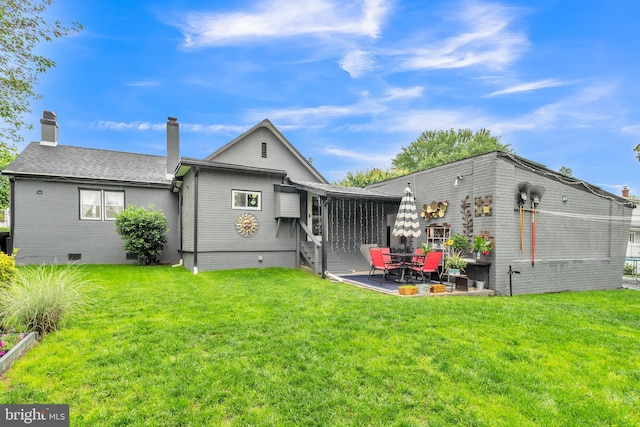1332 Peach St, Upper Chichester, PA 19061 - back of house with brick siding, a patio area, and a yard