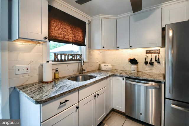 3018 Joshua Rd, Lafayette Hill, PA 19444 - kitchen featuring stainless steel appliances, a sink, tasteful backsplash, and light stone counters