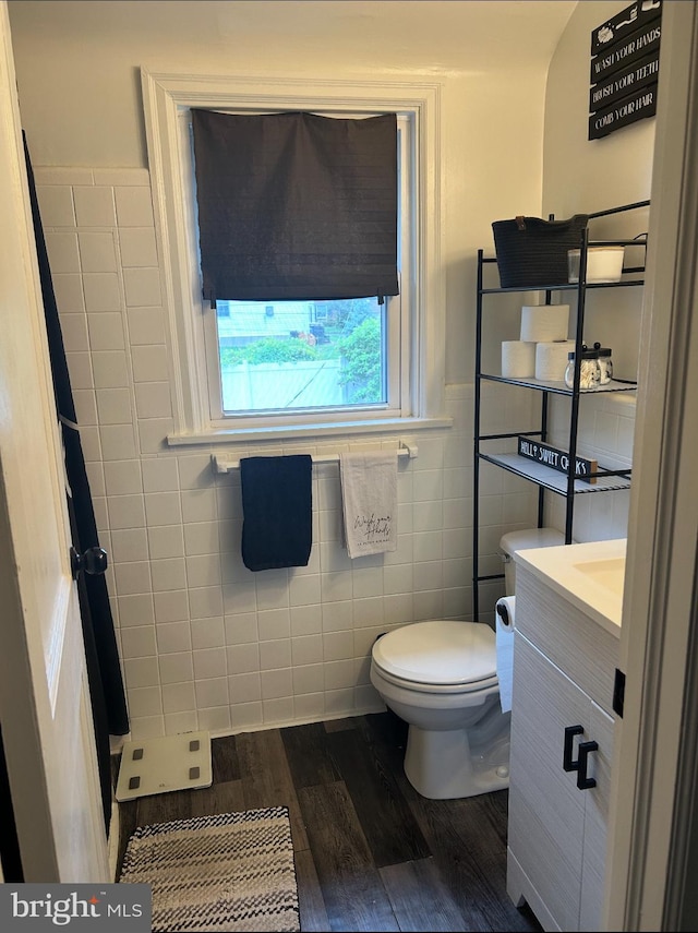 3018 Joshua Rd, Lafayette Hill, PA 19444 - bathroom with vanity, tile walls, toilet, wood finished floors, and a wainscoted wall