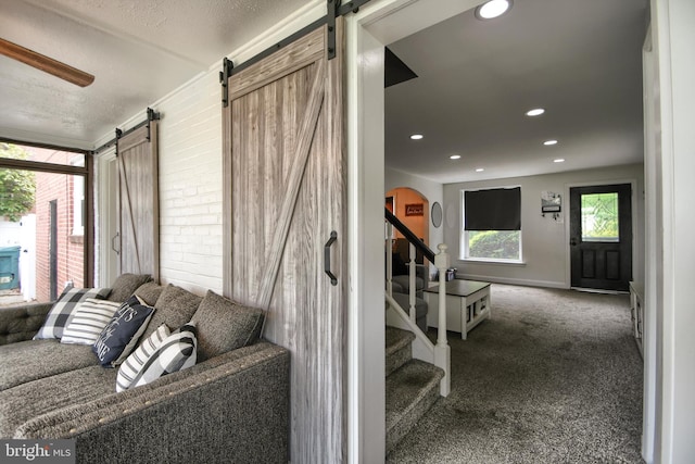 3018 Joshua Rd, Lafayette Hill, PA 19444 - stairway with a barn door, carpet floors, arched walkways, recessed lighting, and baseboards