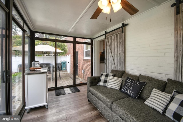 3018 Joshua Rd, Lafayette Hill, PA 19444 - sunroom featuring a barn door, ceiling fan, and outdoor lounge area