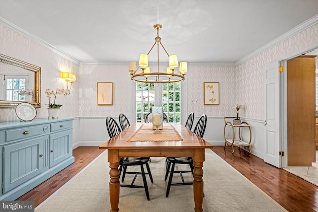 363 Colket Ln, Wayne, PA 19087 - dining room with wood finished floors, wallpapered walls, a chandelier, plenty of natural light, and crown molding