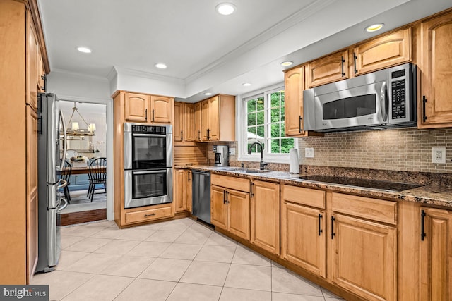 363 Colket Ln, Wayne, PA 19087 - kitchen with appliances with stainless steel finishes, ornamental molding, a sink, tasteful backsplash, and dark stone countertops