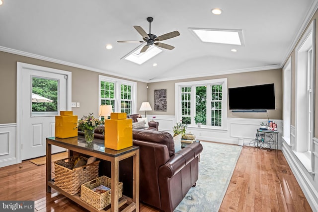 363 Colket Ln, Wayne, PA 19087 - living room featuring a skylight, wainscoting, a ceiling fan, lofted ceiling, and wood-type flooring