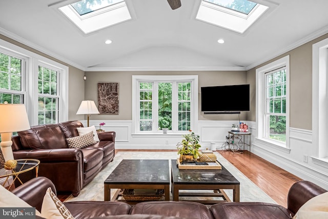 363 Colket Ln, Wayne, PA 19087 - living area with a skylight, vaulted ceiling, light wood-style flooring, wainscoting, and recessed lighting
