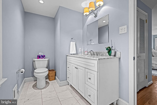 363 Colket Ln, Wayne, PA 19087 - bathroom with vanity, toilet, baseboards, a closet, and marble finish floors
