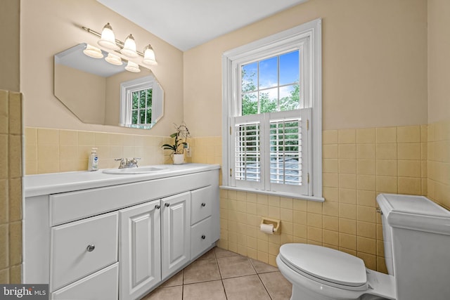 363 Colket Ln, Wayne, PA 19087 - bathroom featuring tile walls, toilet, tile patterned flooring, vanity, and healthy amount of natural light