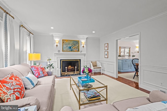 363 Colket Ln, Wayne, PA 19087 - living room featuring ornamental molding, wood finished floors, a lit fireplace, recessed lighting, and a decorative wall