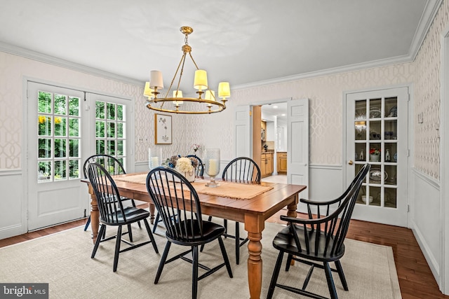 363 Colket Ln, Wayne, PA 19087 - dining room with wallpapered walls, a chandelier, ornamental molding, wood finished floors, and wainscoting