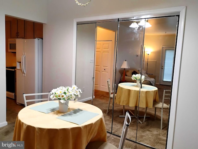 6527 Grange Ln Unit 202, Alexandria, VA 22315 - carpeted dining area featuring baseboards