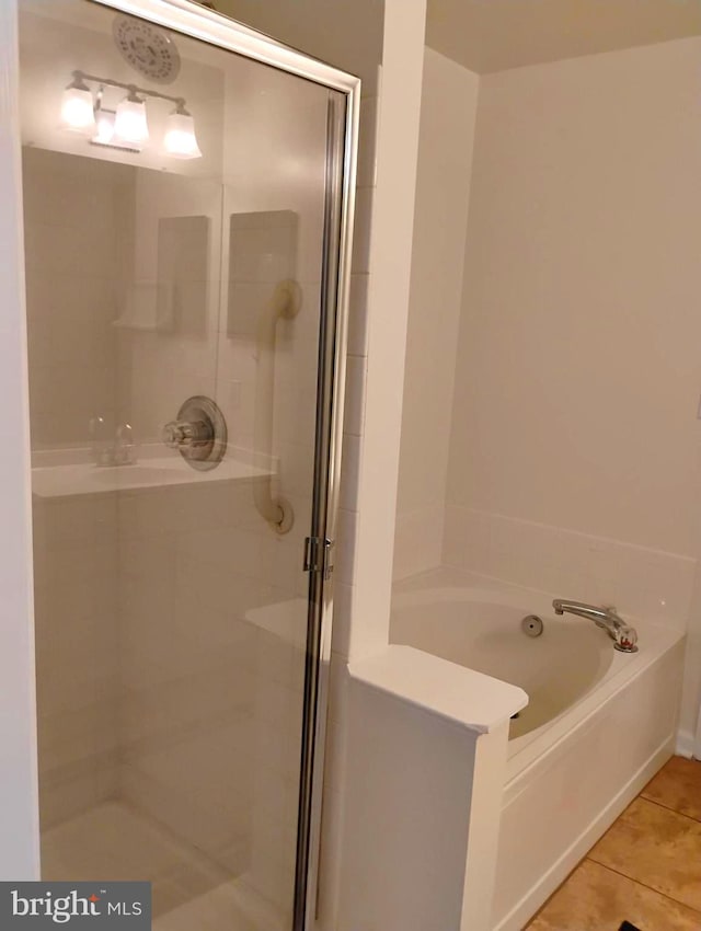 6527 Grange Ln Unit 202, Alexandria, VA 22315 - full bathroom featuring a shower stall, tile patterned flooring, and a garden tub