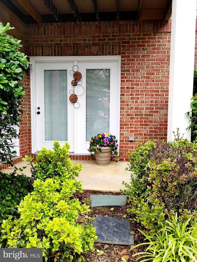 6527 Grange Ln Unit 202, Alexandria, VA 22315 - doorway to property featuring brick siding