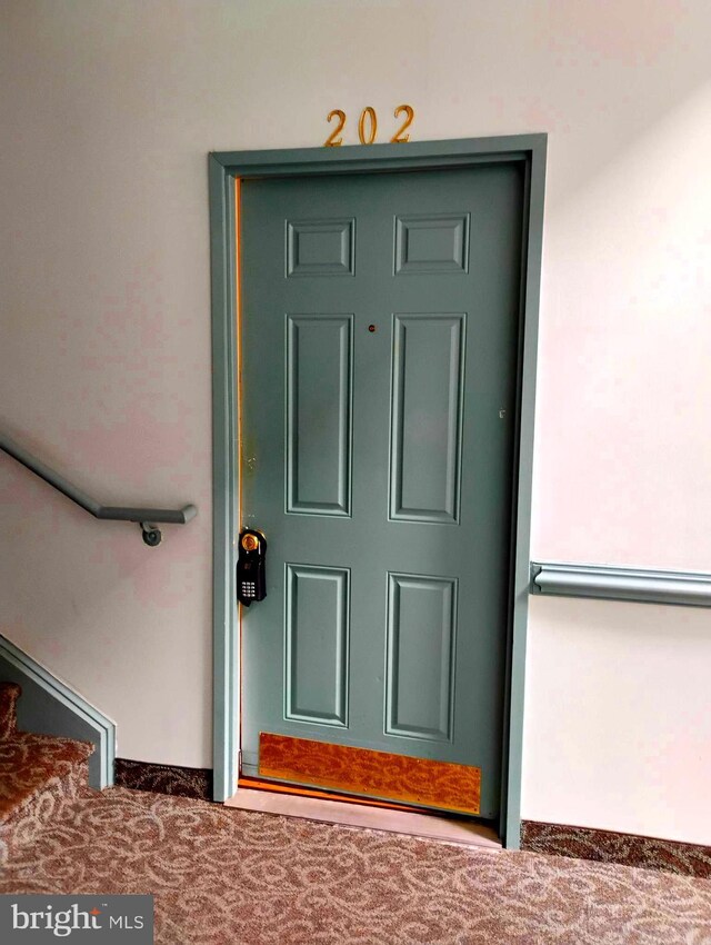 6527 Grange Ln Unit 202, Alexandria, VA 22315 - entrance to property featuring stucco siding