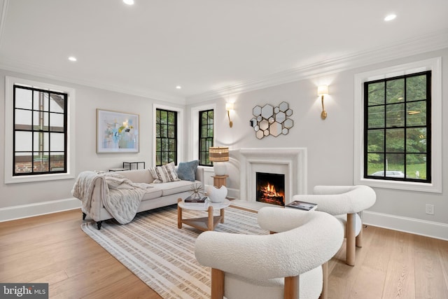5376 28th St NW, Washington, DC 20015 - living area featuring baseboards, recessed lighting, a lit fireplace, light wood finished floors, and crown molding