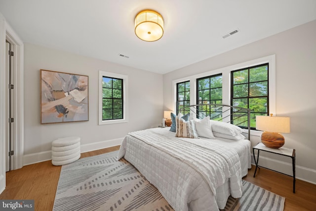 5376 28th St NW, Washington, DC 20015 - bedroom featuring baseboards and wood finished floors