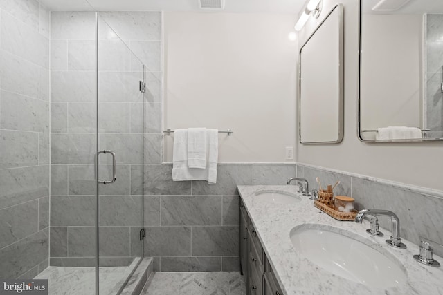 5376 28th St NW, Washington, DC 20015 - full bath featuring a shower stall, double vanity, and a wainscoted wall