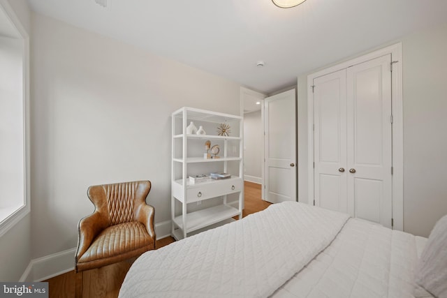 5376 28th St NW, Washington, DC 20015 - bedroom with a closet, baseboards, and wood finished floors