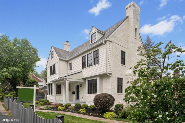5376 28th St NW, Washington, DC 20015 - view of front of home with covered porch, a chimney, and a shingled roof