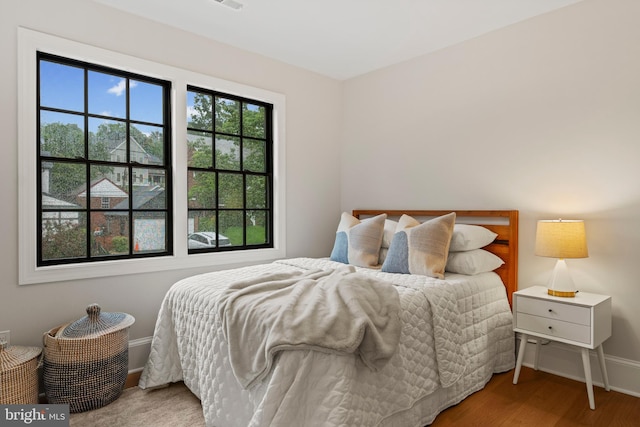 5376 28th St NW, Washington, DC 20015 - bedroom featuring baseboards and wood finished floors