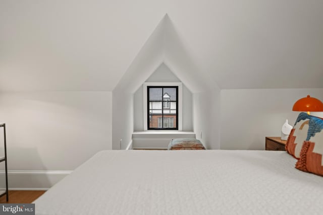 5376 28th St NW, Washington, DC 20015 - bedroom featuring lofted ceiling, baseboards, and wood finished floors