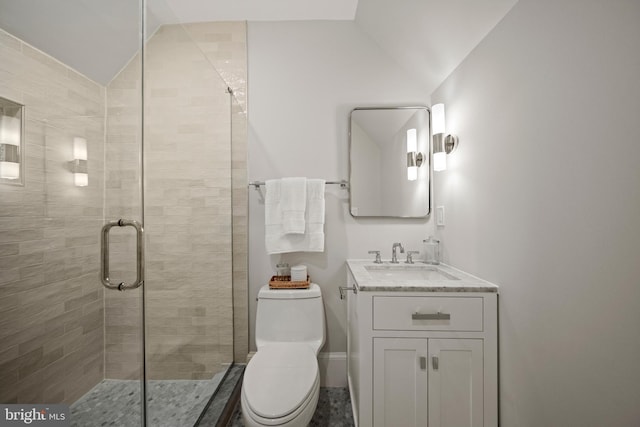 5376 28th St NW, Washington, DC 20015 - bathroom with lofted ceiling, a shower stall, toilet, and vanity