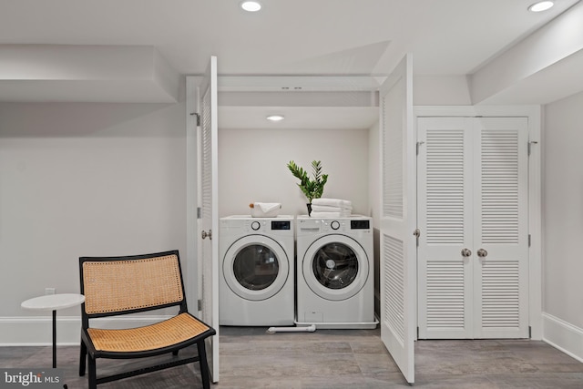 5376 28th St NW, Washington, DC 20015 - laundry room with washing machine and clothes dryer, recessed lighting, baseboards, and wood finished floors