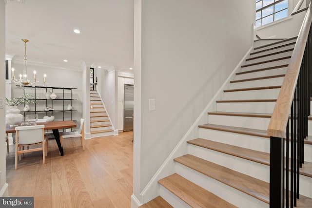 5376 28th St NW, Washington, DC 20015 - stairway with wood finished floors, baseboards, ornamental molding, recessed lighting, and a chandelier