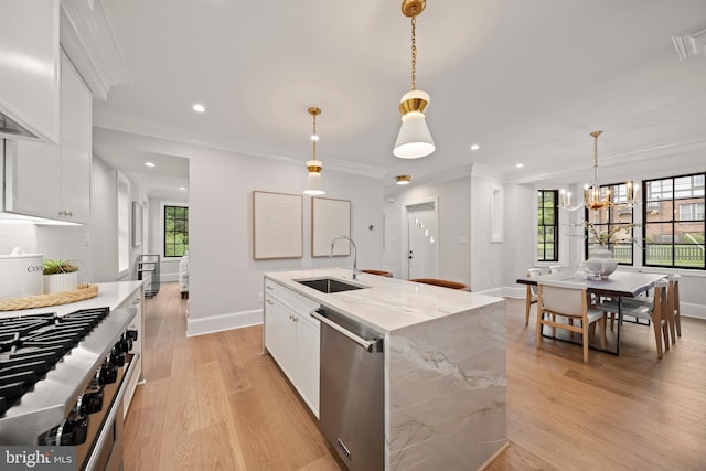 5376 28th St NW, Washington, DC 20015 - kitchen featuring appliances with stainless steel finishes, a sink, plenty of natural light, light wood finished floors, and ornamental molding