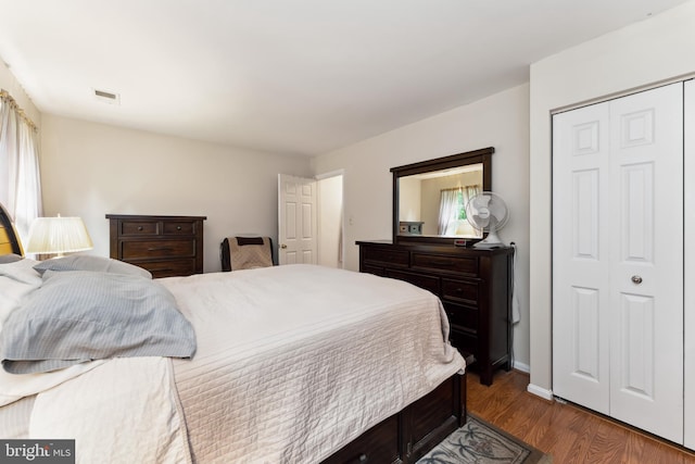 4805 John St, Suitland, MD 20746 - bedroom with wood finished floors, a closet, and baseboards