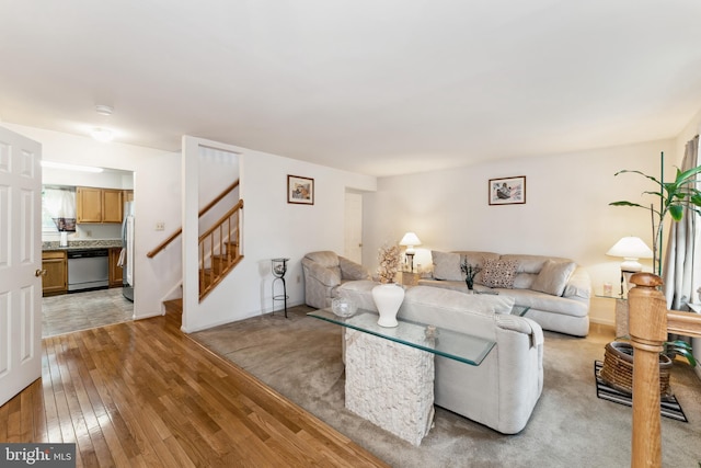 4805 John St, Suitland, MD 20746 - living room featuring light wood-type flooring and stairway