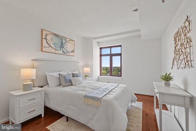 2400 Clarendon Blvd Unit 1015, Arlington, VA 22201 - bedroom featuring dark wood-style floors and baseboards
