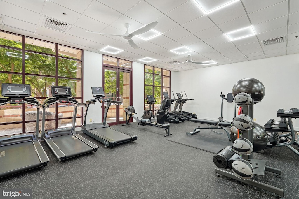 2400 Clarendon Blvd Unit 1015, Arlington, VA 22201 - gym featuring a paneled ceiling, a ceiling fan, and french doors