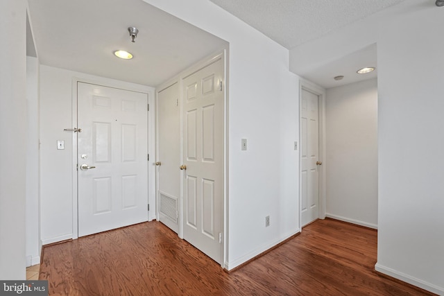 2400 Clarendon Blvd Unit 1015, Arlington, VA 22201 - corridor with wood finished floors, baseboards, and recessed lighting