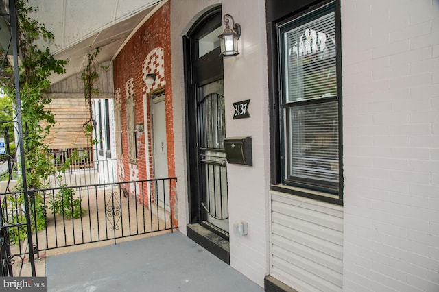 3137 Clifford St, Philadelphia, PA 19121 - doorway to property featuring a porch and brick siding