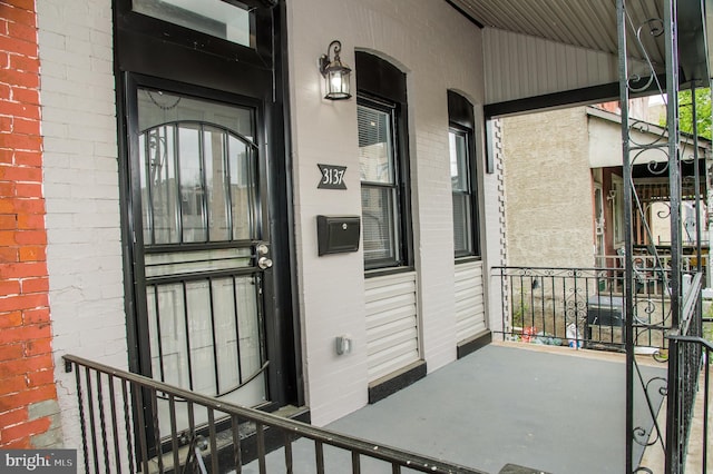 3137 Clifford St, Philadelphia, PA 19121 - view of exterior entry featuring covered porch and brick siding