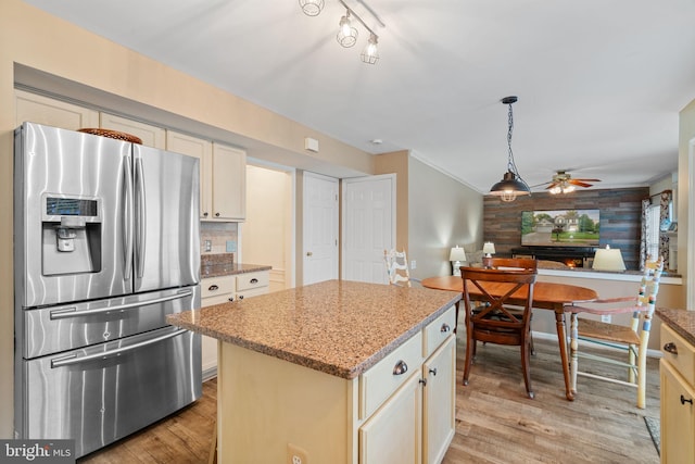 9341 Amaryllis Ave, Manassas, VA 20110 - kitchen with stainless steel fridge with ice dispenser, ceiling fan, light wood finished floors, open floor plan, and a kitchen island