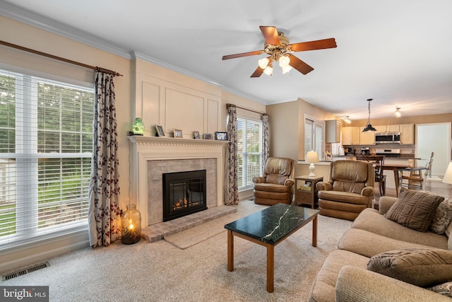 9341 Amaryllis Ave, Manassas, VA 20110 - living area featuring ceiling fan, ornamental molding, a brick fireplace, and light colored carpet