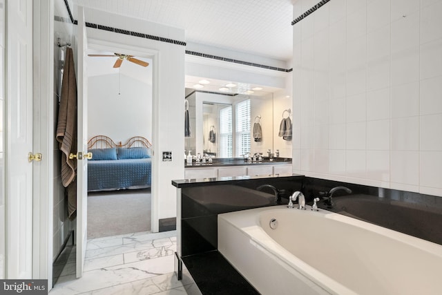 9341 Amaryllis Ave, Manassas, VA 20110 - bathroom with ensuite bathroom, a garden tub, marble finish floors, a ceiling fan, and vanity