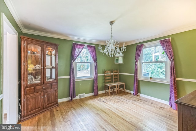 104 Johns Rd, Cheltenham, PA 19012 - dining room featuring a chandelier, healthy amount of natural light, ornamental molding, light wood-style floors, and baseboards