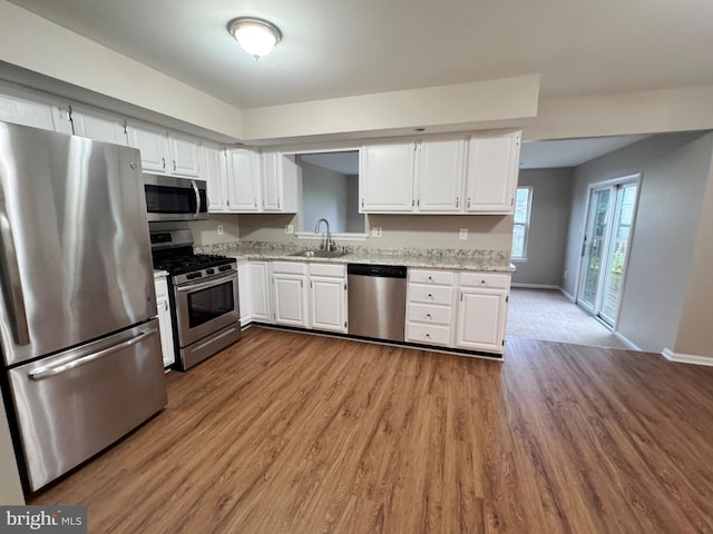 101 Abbey Ln, Telford, PA 18969 - kitchen with appliances with stainless steel finishes, dark wood finished floors, white cabinetry, and a sink